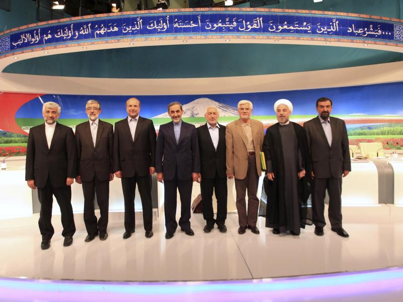 After a TV debate on May 31, presidential candidates at the time appear onstage: Saeed Jalili (from left), Gholam Ali Haddad Adel, Mohammad Bagher Qalibaf, Ali Akbar Velayati, Mohammad Gharazi, Mohammad Reza Aref, Hassan Rowhani, Mohsen Rezaei. Aref dropp After a TV debate on May 31, presidential candidates at the time appear onstage: Saeed Jalili (from left), Gholam Ali Haddad Adel, Mohammad Bagher Qalibaf, Ali Akbar Velayati, Mohammad Gharazi, Mohammad Reza Aref, Hassan Rowhani, Mohsen Rezaei. Aref dropp