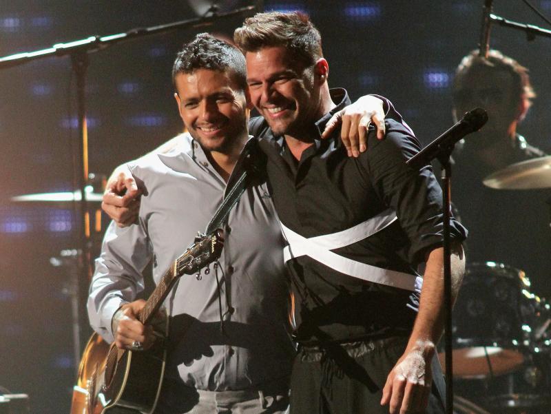 Former bandmates Draco Rosa and Ricky Martin, seen here on stage at Univision's 2013 Premio Lo Nuestro awards celebration, reunite on Rosa's new album, Vida. Former bandmates Draco Rosa and Ricky Martin, seen here on stage at Univision's 2013 Premio Lo Nuestro awards celebration, reunite on Rosa's new album, Vida.