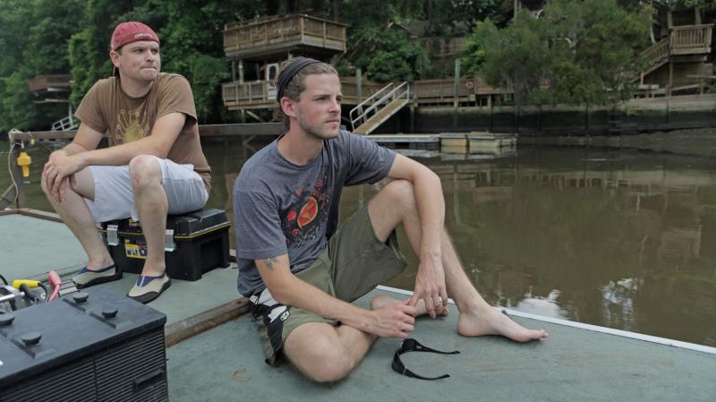 Louis Marcell and Adam Jones prepare to search for old logs, known as sinker wood, on the bottom of Ashley River near Charleston, S.C. They use sonar and a book of old train lines to find the timber, some of which has been preserved in the mud since the 1 Louis Marcell and Adam Jones prepare to search for old logs, known as sinker wood, on the bottom of Ashley River near Charleston, S.C. They use sonar and a book of old train lines to find the timber, some of which has been preserved in the mud since the 1