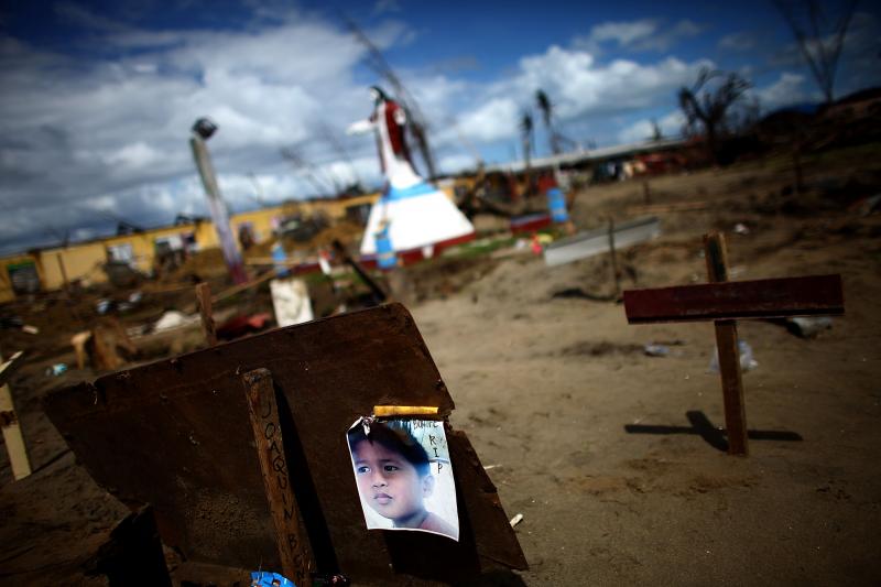 A makeshift graveyard outside San Joaquin Parish is now the final resting place of hundreds in the province of Leyte, Philippines. A makeshift graveyard outside San Joaquin Parish is now the final resting place of hundreds in the province of Leyte, Philippines.