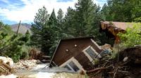 Flooding brought down a house in Jamestown, Colo., on Sept. 18. Flooding brought down a house in Jamestown, Colo., on Sept. 18.