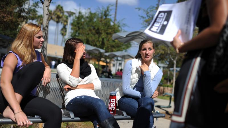 Students Amanda McComas, Rose Marie Chute and Sari Schwartz are approached in October at Santa Monica City College in California about signing up for insurance with the Affordable Care Act. Students Amanda McComas, Rose Marie Chute and Sari Schwartz are approached in October at Santa Monica City College in California about signing up for insurance with the Affordable Care Act.