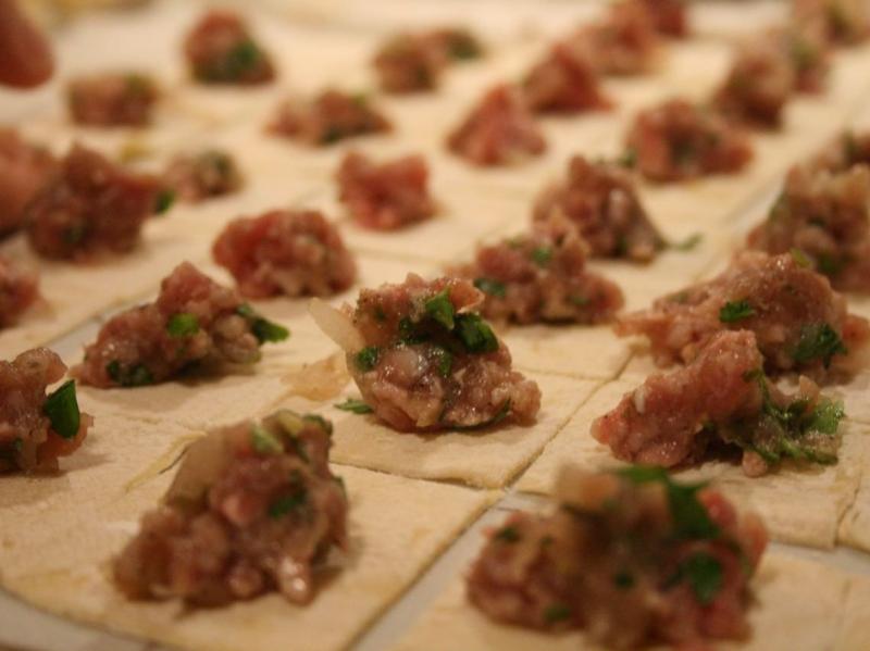 In Turkey, bits of meat are wrapped in squares of pasta to make manti. In Turkey, bits of meat are wrapped in squares of pasta to make manti.