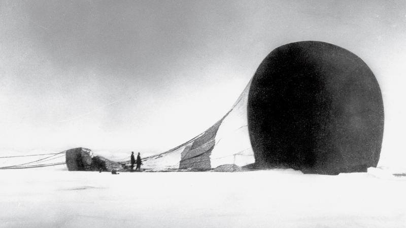 Members of S. A. Andrée's 1897 journey survey their downed vessel. This photo was recovered from a camera when their remains were found 33 years later. Members of S. A. Andrée's 1897 journey survey their downed vessel. This photo was recovered from a camera when their remains were found 33 years later.