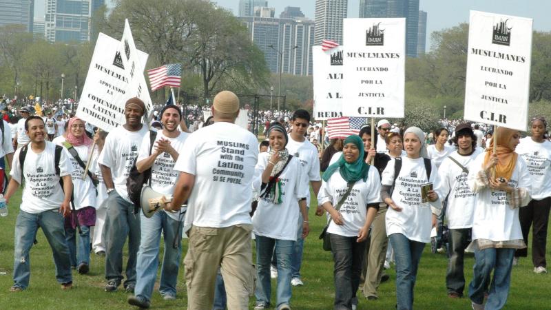 Rami Nashashibi, fourth from left, claps as he marches with IMAN leaders during a May Day immigration rally in Chicago in 2007. Rami Nashashibi, fourth from left, claps as he marches with IMAN leaders during a May Day immigration rally in Chicago in 2007.