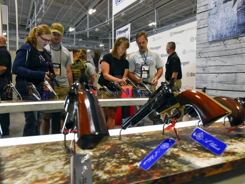 Attendees visit the trade booths during the National Rifle Association's annual meeting in Nashville, Tenn., in April. Attendees visit the trade booths during the National Rifle Association's annual meeting in Nashville, Tenn., in April.