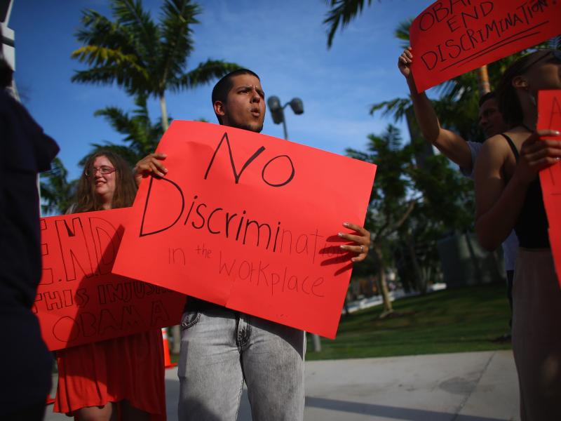 Esteban Roncancio and other protesters call for executive action on workplace discrimination for LGBT Americans in Miami. Esteban Roncancio and other protesters call for executive action on workplace discrimination for LGBT Americans in Miami.