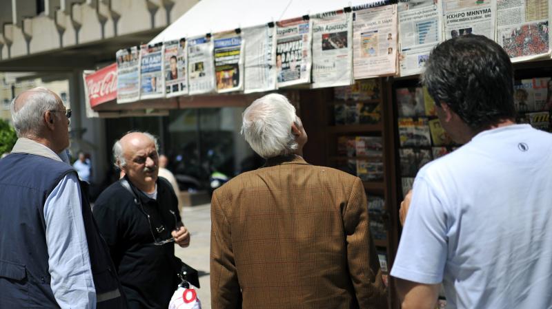 People read newspaper headlines in Athens. In 2009, there were 39 national dailies, 23 national Sunday papers, 14 national weekly papers and dozens of TV and radio stations for a population of 11 million. People read newspaper headlines in Athens. In 2009, there were 39 national dailies, 23 national Sunday papers, 14 national weekly papers and dozens of TV and radio stations for a population of 11 million.