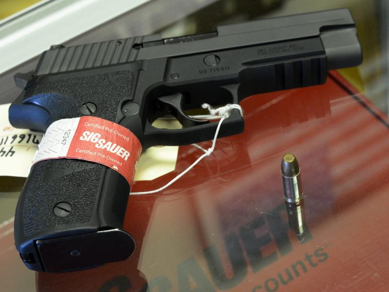 A Sig Sauer handgun on sale at a shop in Tucker, Ga. A Sig Sauer handgun on sale at a shop in Tucker, Ga.