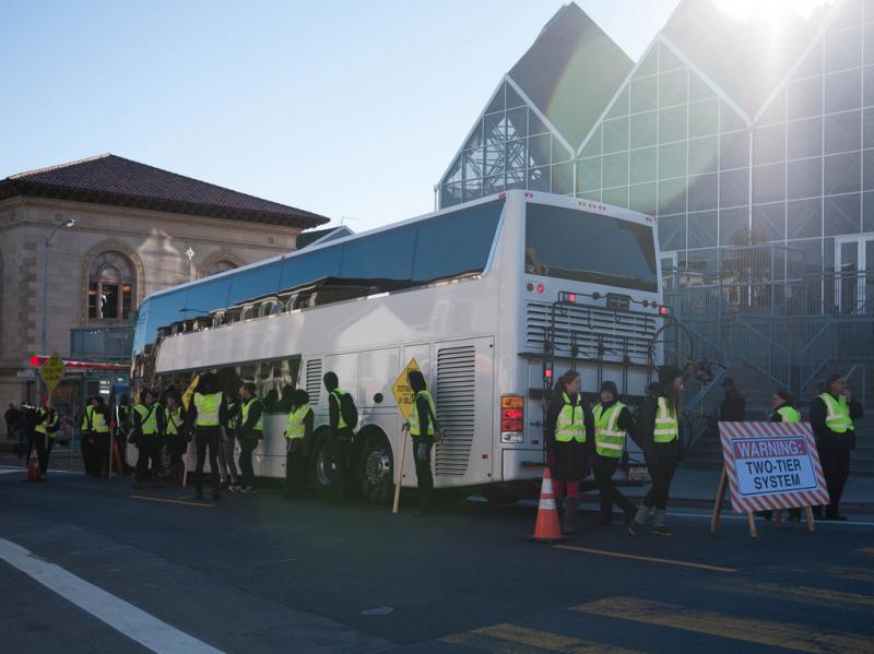 Protesters in San Francisco block a Google bus, which shuttles employees from the city to its location in Silicon Valley. Protesters in San Francisco block a Google bus, which shuttles employees from the city to its location in Silicon Valley.