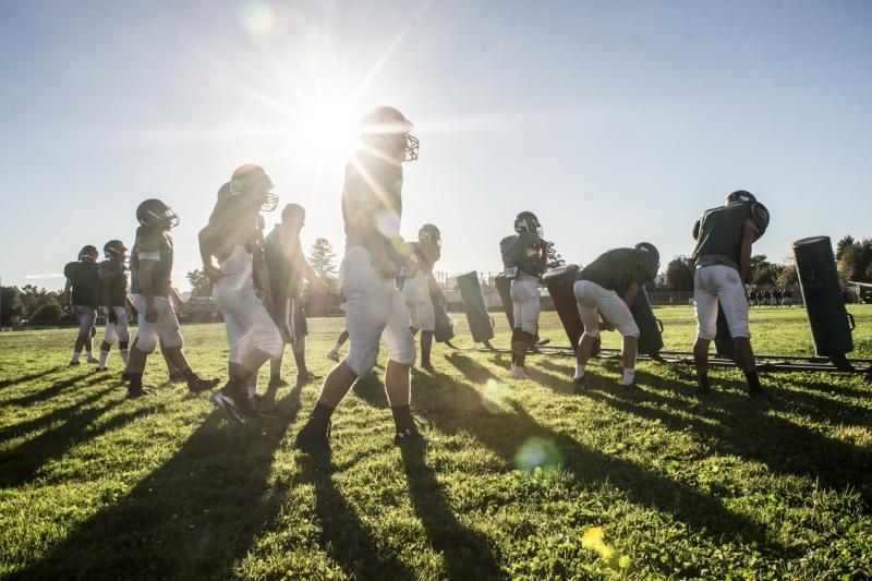 Football practice at Castro Valley High School in California. Proper hitting technique requires players to keep their heads up to prevent neck injuries and concussions. Football practice at Castro Valley High School in California. Proper hitting technique requires players to keep their heads up to prevent neck injuries and concussions.