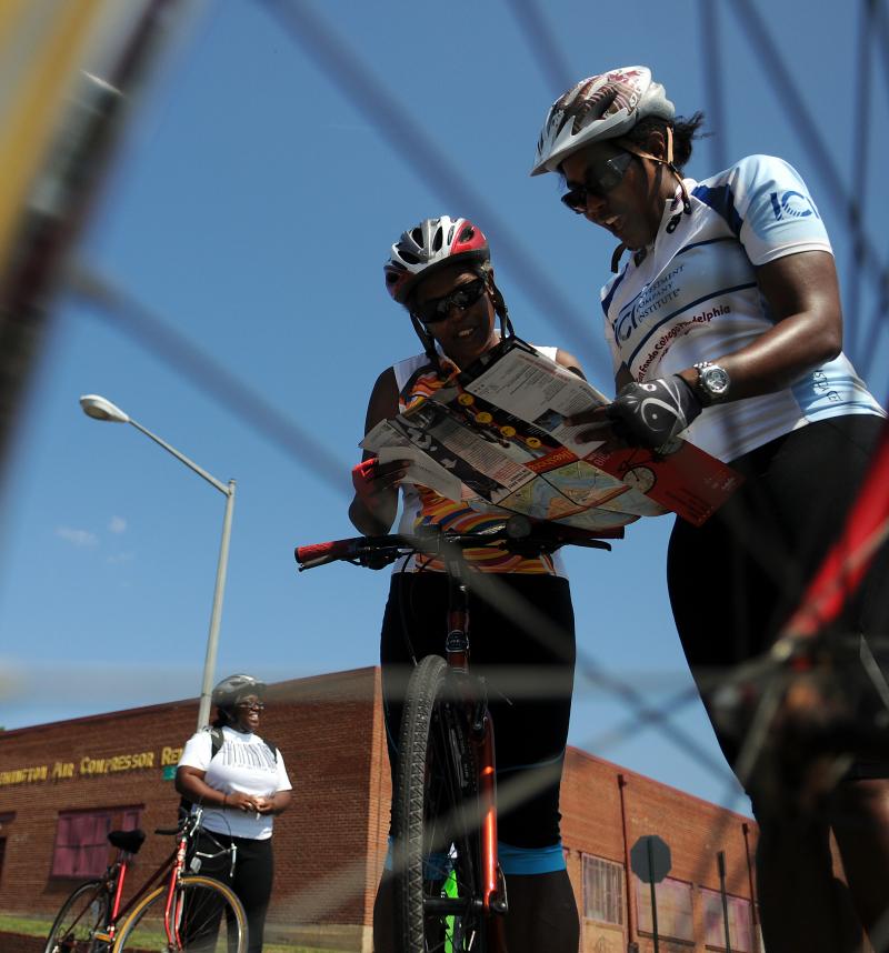 Members of Black Women Bike: DC consult a map while on the road at an event in June 2011. Members of Black Women Bike: DC consult a map while on the road at an event in June 2011.