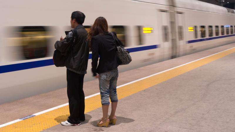 A couple waits for a high-speed train in the Chinese city of Qinhuangdao. Modern infrastructure and the expanding private sector have greatly increased efficiency and customer service in many parts of Chinese life. A couple waits for a high-speed train in the Chinese city of Qinhuangdao. Modern infrastructure and the expanding private sector have greatly increased efficiency and customer service in many parts of Chinese life.