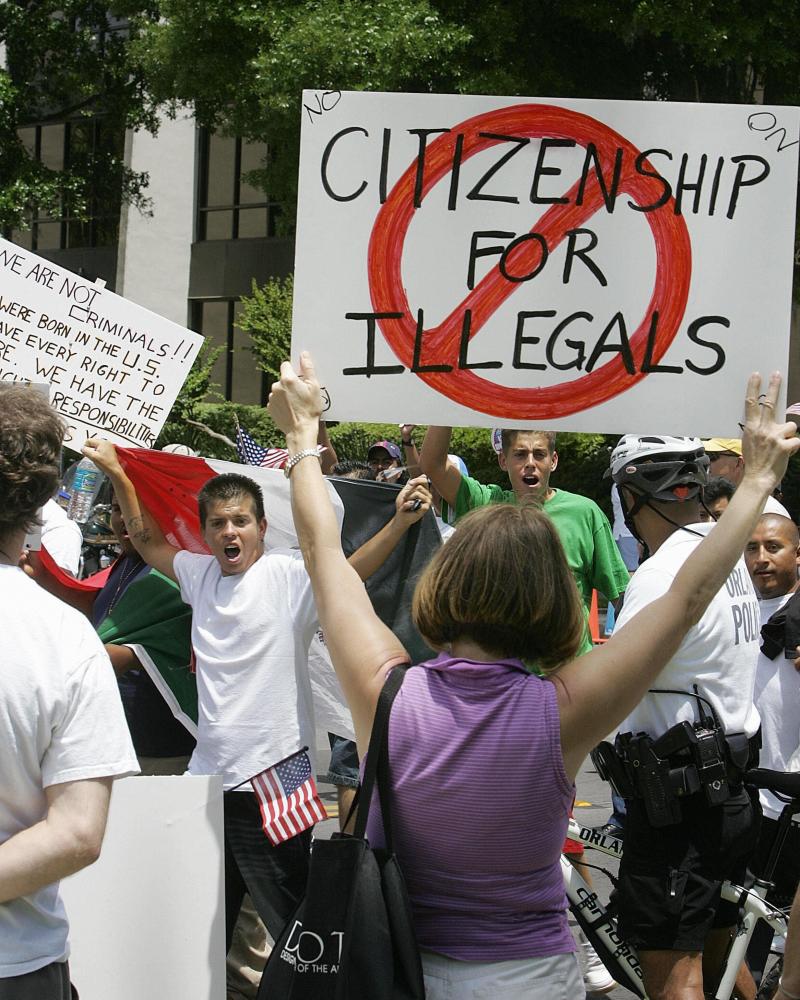 Protesters demonstrate in downtown Orlando, Fla., on May 1, 2006. Most news outlets have long abandoned the use of the term "illegals." Protesters demonstrate in downtown Orlando, Fla., on May 1, 2006. Most news outlets have long abandoned the use of the term "illegals."