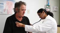 Dr. Madhumathi Gunasekaran examines John Pike at the Northgate II clinic in Camden, N.J. Dr. Madhumathi Gunasekaran examines John Pike at the Northgate II clinic in Camden, N.J.