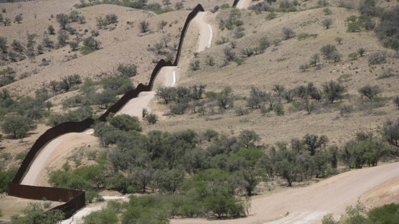 A hilltop view of the 18-foot fence along the U.S.-Mexico border west of Nogales, Ariz. A hilltop view of the 18-foot fence along the U.S.-Mexico border west of Nogales, Ariz.