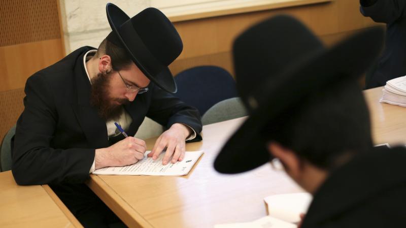 Ultra-Orthodox Jews are not required to perform military service in Israel, and the issue is subject to intense debate following the country's election last week. Here, ultra-Orthodox men sign up for alternate civilian service earlier this month. Ultra-Orthodox Jews are not required to perform military service in Israel, and the issue is subject to intense debate following the country's election last week. Here, ultra-Orthodox men sign up for alternate civilian service earlier this month.