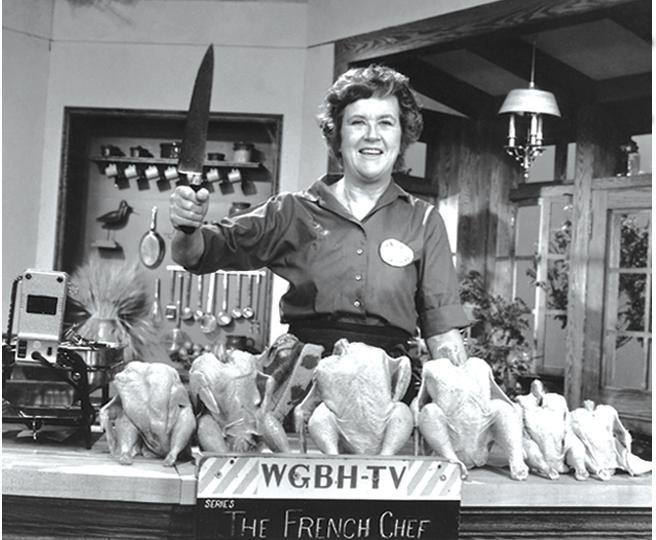 Julia Child poses with "the chicken sisters" before an episode of The French Chef in which she teaches us how to roast a bird. Julia Child poses with "the chicken sisters" before an episode of The French Chef in which she teaches us how to roast a bird.