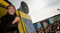 American actor David Hasselhoff speaks to protesters next to a remnant of the Berlin Wall last week. Thousands of people turned out to oppose a plan to knock down one of the few remaining sections of the wall. A small part was removed Wednesday. American actor David Hasselhoff speaks to protesters next to a remnant of the Berlin Wall last week. Thousands of people turned out to oppose a plan to knock down one of the few remaining sections of the wall. A small part was removed Wednesday.
