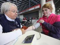 Low-income adults formerly had few options for free health care. Leah Sessor had her blood pressure taken on April 14, 2012, during a free clinic at a racetrack in Bristol, Tenn. Low-income adults formerly had few options for free health care. Leah Sessor had her blood pressure taken on April 14, 2012, during a free clinic at a racetrack in Bristol, Tenn.