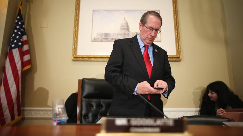 Rep. Bob Goodlatte, R-Va., checks his phone before a hearing on Capitol Hill in September. Rep. Bob Goodlatte, R-Va., checks his phone before a hearing on Capitol Hill in September.