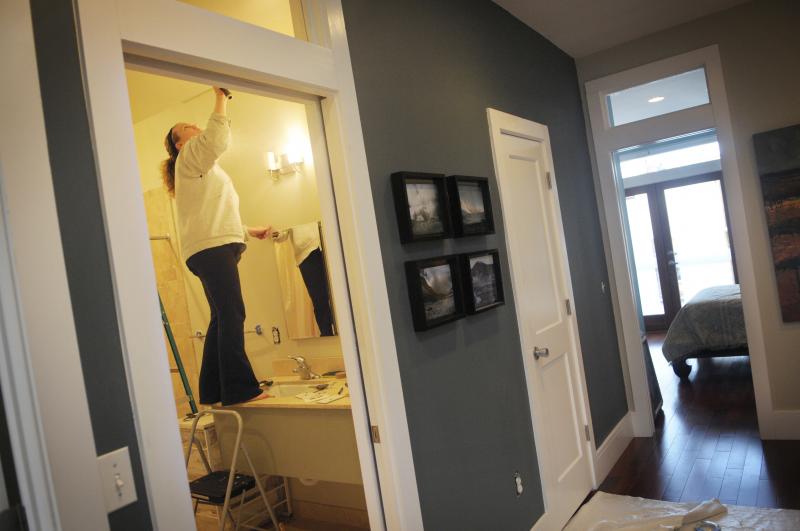 Amanda Cowley repaints her bathroom during renovations made to her new three-bedroom, two-bathroom townhouse. Amanda Cowley repaints her bathroom during renovations made to her new three-bedroom, two-bathroom townhouse.
