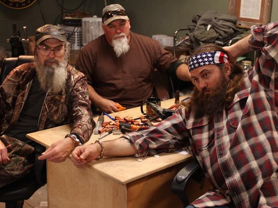 Some of the cast members of the reality show Duck Dynasty find themselves handcuffed to one another. Some of the cast members of the reality show Duck Dynasty find themselves handcuffed to one another.