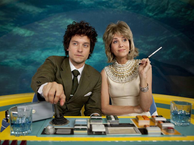 IFC's The Spoils Of Babylon follows a sister (Kristin Wiig) and adopted brother (Tobey Maguire) caught up in a passionate romance. IFC's The Spoils Of Babylon follows a sister (Kristin Wiig) and adopted brother (Tobey Maguire) caught up in a passionate romance.