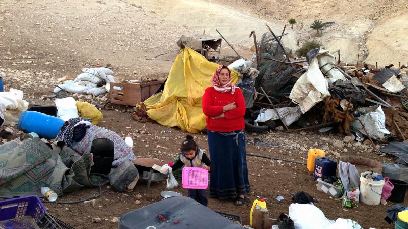 Nehida Bne Menneh stands amid the rubble of her home in a small Palestinian herding camp in the Israeli-occupied West Bank. It was destroyed for being in an area Israel long ago declared a closed military zone. Nehida Bne Menneh stands amid the rubble of her home in a small Palestinian herding camp in the Israeli-occupied West Bank. It was destroyed for being in an area Israel long ago declared a closed military zone.