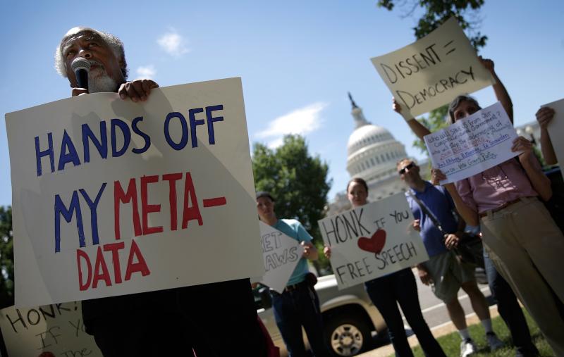 Protesters gather outside the U.S. Capitol on Thursday to rally against the National Security Agency's recently detailed surveillance programs. Protesters gather outside the U.S. Capitol on Thursday to rally against the National Security Agency's recently detailed surveillance programs.