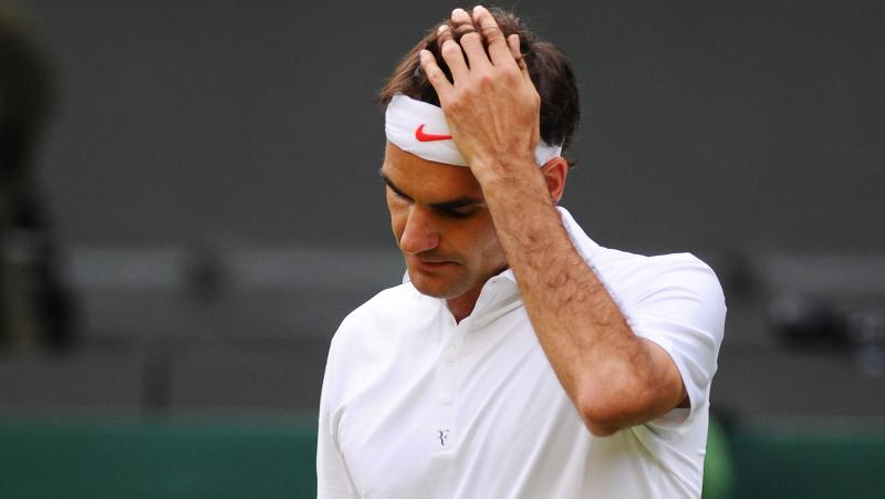 Roger Federer of Switzerland reacts during his Gentlemen's Singles second round match against Sergiy Stakhovsky of Ukraine on day three of the Wimbledon Lawn Tennis Championships at the All England Lawn Tennis and Croquet Club on June 26. Roger Federer of Switzerland reacts during his Gentlemen's Singles second round match against Sergiy Stakhovsky of Ukraine on day three of the Wimbledon Lawn Tennis Championships at the All England Lawn Tennis and Croquet Club on June 26.