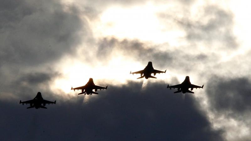 Four F-16s from the 77th Fighter Squadron of Shaw Air Force Base fly over Darlington Raceway before a NASCAR race in Darlington, S.C., in May 2012. Four F-16s from the 77th Fighter Squadron of Shaw Air Force Base fly over Darlington Raceway before a NASCAR race in Darlington, S.C., in May 2012.