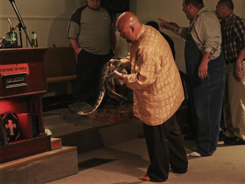 Pastor Jamie Coots holds a snake at Full Gospel Tabernacle in Jesus Name Church of Middlesboro, Ky. Pastor Jamie Coots holds a snake at Full Gospel Tabernacle in Jesus Name Church of Middlesboro, Ky.