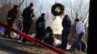 People visit a memorial outside Sandy Hook Elementary School in Newtown, Conn., on Dec. 15. People visit a memorial outside Sandy Hook Elementary School in Newtown, Conn., on Dec. 15.