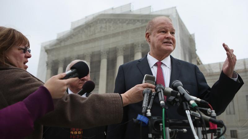 Arizona Attorney General Thomas Horne talks with reporters outside the U.S. Supreme Court after oral arguments in the case challenging Arizona's voter registration law on Monday. Arizona Attorney General Thomas Horne talks with reporters outside the U.S. Supreme Court after oral arguments in the case challenging Arizona's voter registration law on Monday.
