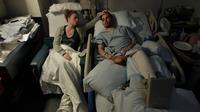 Jen Regan strokes the head of her fiancée, Marc Fucarile, as he sleeps in his hospital bed at Massachusetts General Hospital. Fucarile was injured in the bombings at the Boston Marathon, and had to have his right leg amputated. Jen Regan strokes the head of her fiancée, Marc Fucarile, as he sleeps in his hospital bed at Massachusetts General Hospital. Fucarile was injured in the bombings at the Boston Marathon, and had to have his right leg amputated.