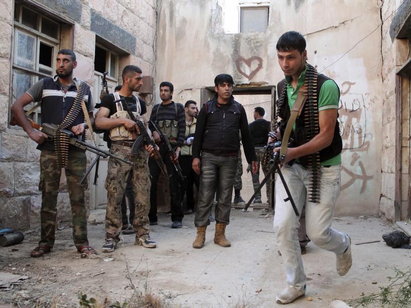 Free Syrian Army fighters prepare to raid a house in Dara'a on May 16. Free Syrian Army fighters prepare to raid a house in Dara'a on May 16.