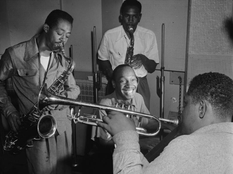 Tadd Dameron (smiling at center) was an important figure in American jazz and bebop. He is shown here with Fats Navarro on trumpet, and Charlie Rouse and Ernie Henry on saxophone. Tadd Dameron (smiling at center) was an important figure in American jazz and bebop. He is shown here with Fats Navarro on trumpet, and Charlie Rouse and Ernie Henry on saxophone.