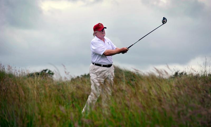 Donald Trump plays a stroke as he officially opens his new Trump International Golf Links course in Aberdeenshire, Scotland, last July. Now, he is aggressively fighting Scottish plans to build 11 wind turbines off the coast overlooked by his golf course a Donald Trump plays a stroke as he officially opens his new Trump International Golf Links course in Aberdeenshire, Scotland, last July. Now, he is aggressively fighting Scottish plans to build 11 wind turbines off the coast overlooked by his golf course a