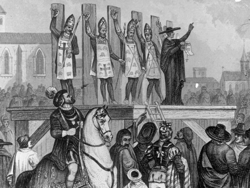 An illustration shows heretics being tortured and nailed to wooden posts during the first Inquisition. An illustration shows heretics being tortured and nailed to wooden posts during the first Inquisition.