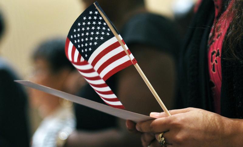 Newly sworn-in U.S. citizens recite the Pledge of Allegiance during a naturalization ceremony in Baltimore in 2012. Newly sworn-in U.S. citizens recite the Pledge of Allegiance during a naturalization ceremony in Baltimore in 2012.