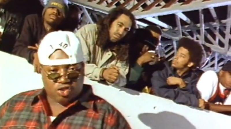 A still from the video for E-40's 1993 song "Practice Looking Hard," in which rappers like The Coup's Boots Riley (second from right) and Tupac (not pictured) also appeared. A still from the video for E-40's 1993 song "Practice Looking Hard," in which rappers like The Coup's Boots Riley (second from right) and Tupac (not pictured) also appeared.