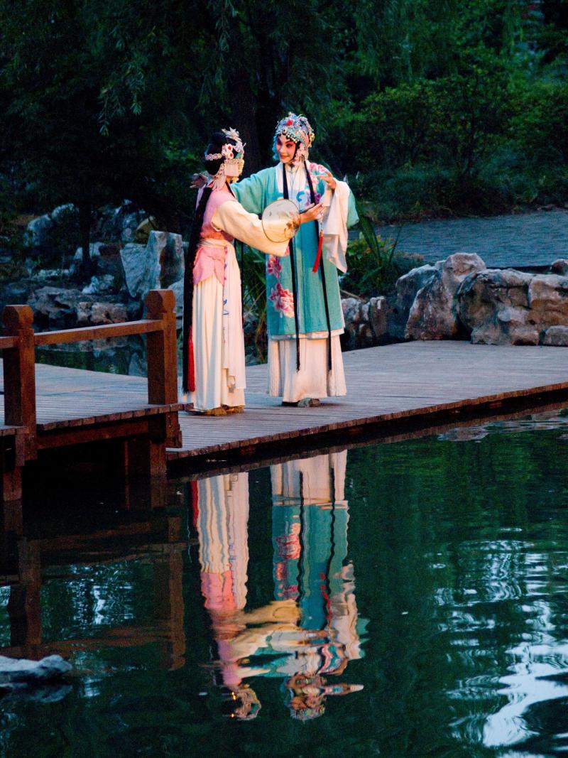 A garden serves as the stage in the opera. A garden serves as the stage in the opera.