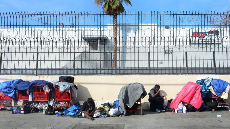 Homeless women sit amid their belongings in downtown Los Angeles on Wednesday. Democrats and Republicans say income inequality is a problem, but they disagree over a solution. Homeless women sit amid their belongings in downtown Los Angeles on Wednesday. Democrats and Republicans say income inequality is a problem, but they disagree over a solution.