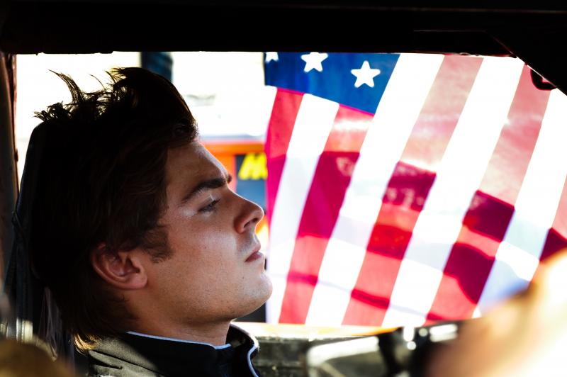 In Ramin Bahrani's At Any Price, Zac Efron stars as a teen rebelling against his family and dreaming of becoming a professional race car driver. Sound like a generic summer pic? Critic David Edelstein says the film has "a hell of a sting in its tail." In Ramin Bahrani's At Any Price, Zac Efron stars as a teen rebelling against his family and dreaming of becoming a professional race car driver. Sound like a generic summer pic? Critic David Edelstein says the film has "a hell of a sting in its tail."