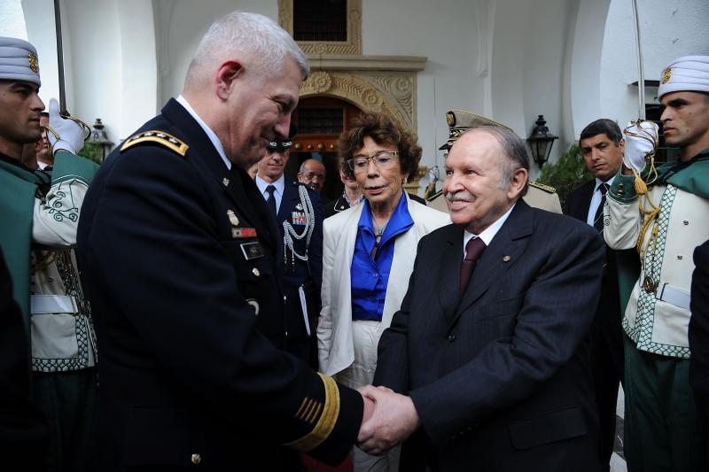 Gen. Carter Ham, who heads the U.S. Africa Command, meets with Algerian President Abdelaziz Bouteflika last September. Amid upheaval in the region, AFRICOM is still attempting to define its mission. Gen. Carter Ham, who heads the U.S. Africa Command, meets with Algerian President Abdelaziz Bouteflika last September. Amid upheaval in the region, AFRICOM is still attempting to define its mission.