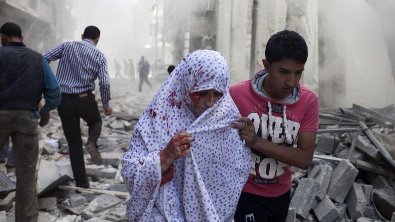 A Syrian woman is evacuated after being wounded in shelling by regime forces in the Shaar neighborhood of the northern Syrian city of Aleppo, on Oct. 13, 2012. A Syrian woman is evacuated after being wounded in shelling by regime forces in the Shaar neighborhood of the northern Syrian city of Aleppo, on Oct. 13, 2012.