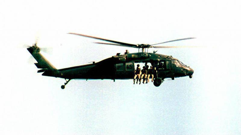 A U.S. UH-60 Black Hawk helicopter flies over Somalia in September 1993, a month before the battle of Mogadishu. A U.S. UH-60 Black Hawk helicopter flies over Somalia in September 1993, a month before the battle of Mogadishu.