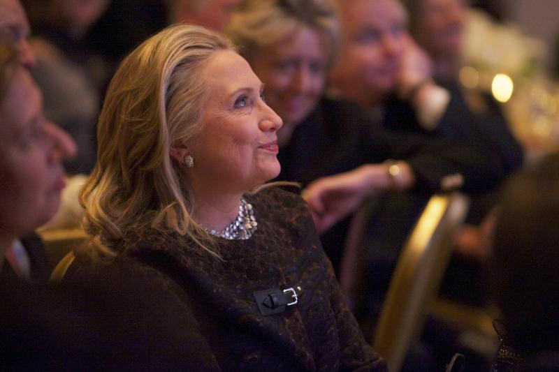 Secretary of State Hillary Clinton watches a video about her public life that was played before she addressed the Saban Forum in Washington last week. Secretary of State Hillary Clinton watches a video about her public life that was played before she addressed the Saban Forum in Washington last week.