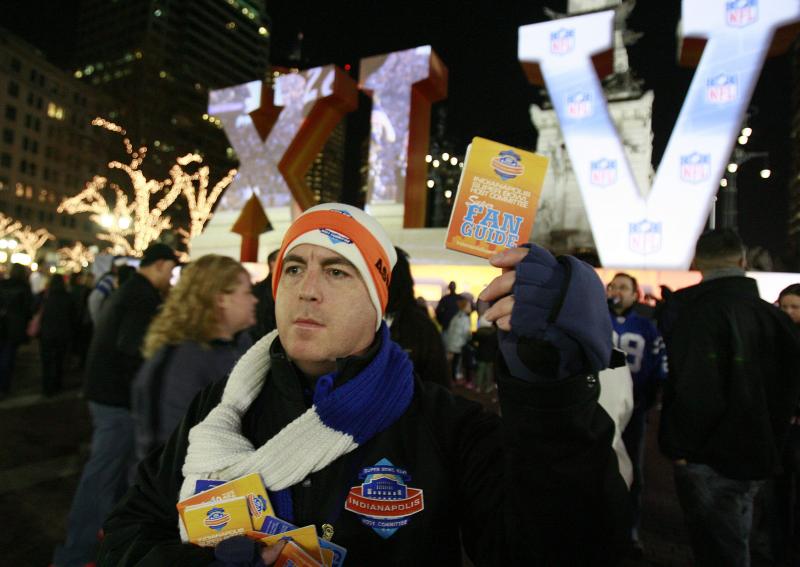 Super Bowl volunteer Ben Schreiber distributes fan guides to any of the thousands of people who may need them while visiting Indianapolis for Super Bowl XLVI festivities, in 2012. Super Bowl volunteer Ben Schreiber distributes fan guides to any of the thousands of people who may need them while visiting Indianapolis for Super Bowl XLVI festivities, in 2012.